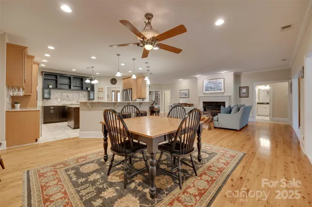 a living room with furniture kitchen view and a dining table