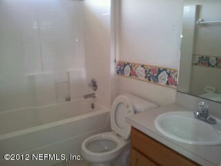 6857 Crystal River Road Jacksonville, FL 32219 - Photo 8 of 8 a bathroom with a sink a toilet and a bathtub