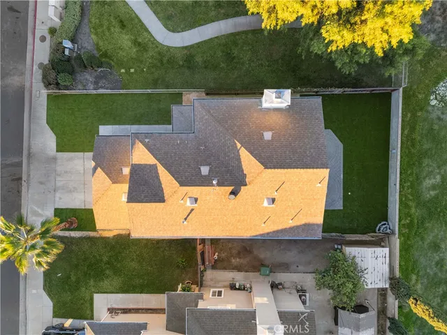 an aerial view of a house with a garden