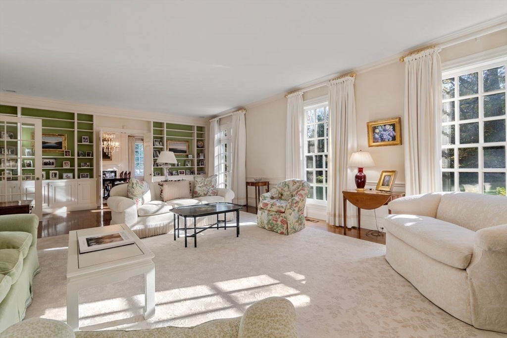 71 Sears Road Brookline, MA 02445 - Photo 7 of 18 a living room with furniture and a large window