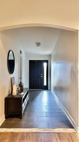 a room with wooden floor and furniture