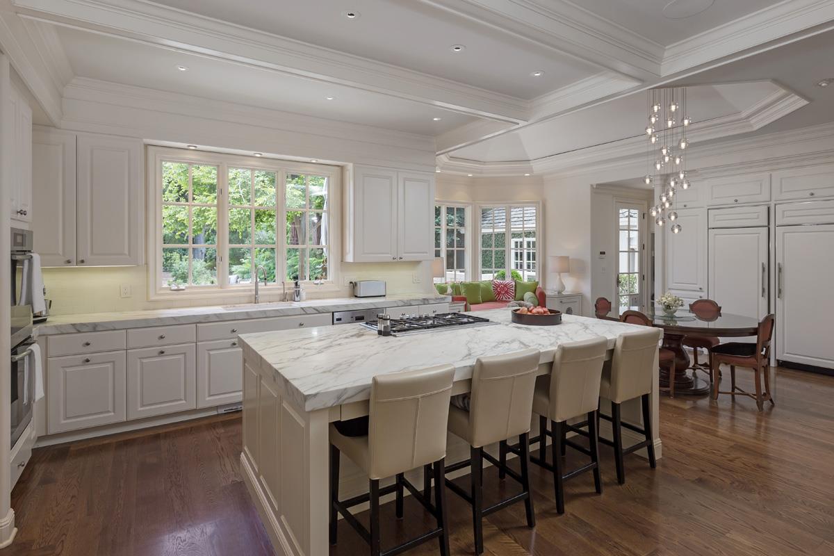 87 Patricia Drive Atherton, CA 94027 - Photo 13 of 41 a kitchen with a table chairs sink and cabinets