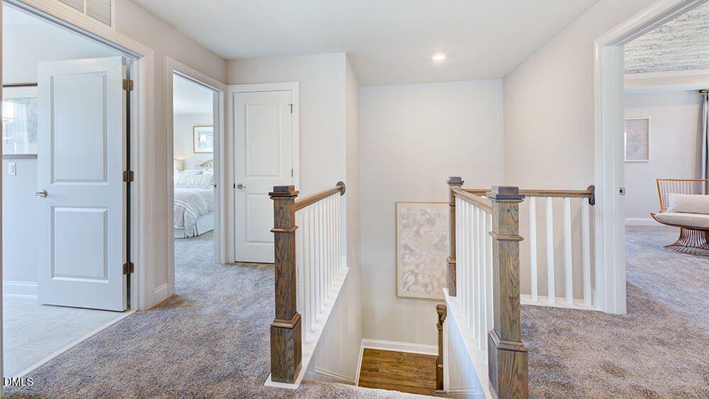 229 Tidal Pool Way Cary, NC 27519 - Photo 16 of 32 a view of a bedroom with wooden floor and bathroom
