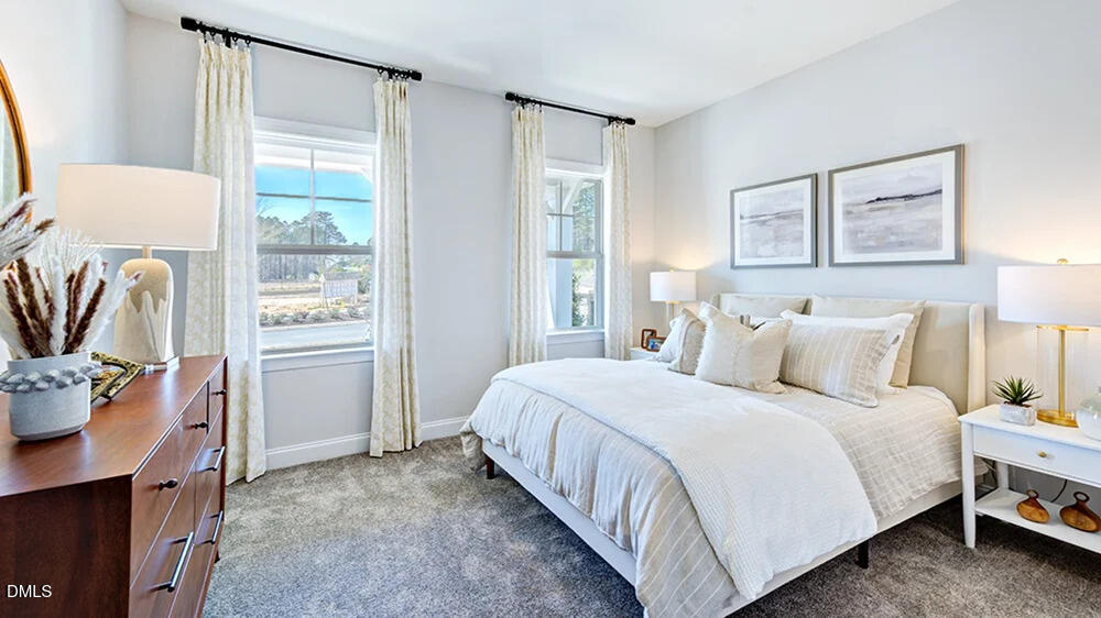 229 Tidal Pool Way Cary, NC 27519 - Photo 25 of 32 a bedroom with a bed and a window