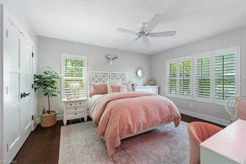 a bed room with a bed and a potted plant