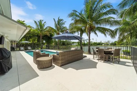 a view of outdoor space with seating area and swimming pool