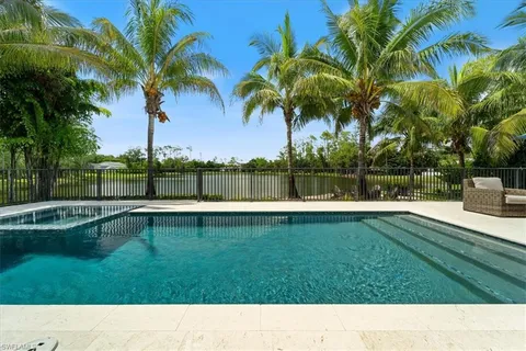 a view of swimming pool with a garden and trees