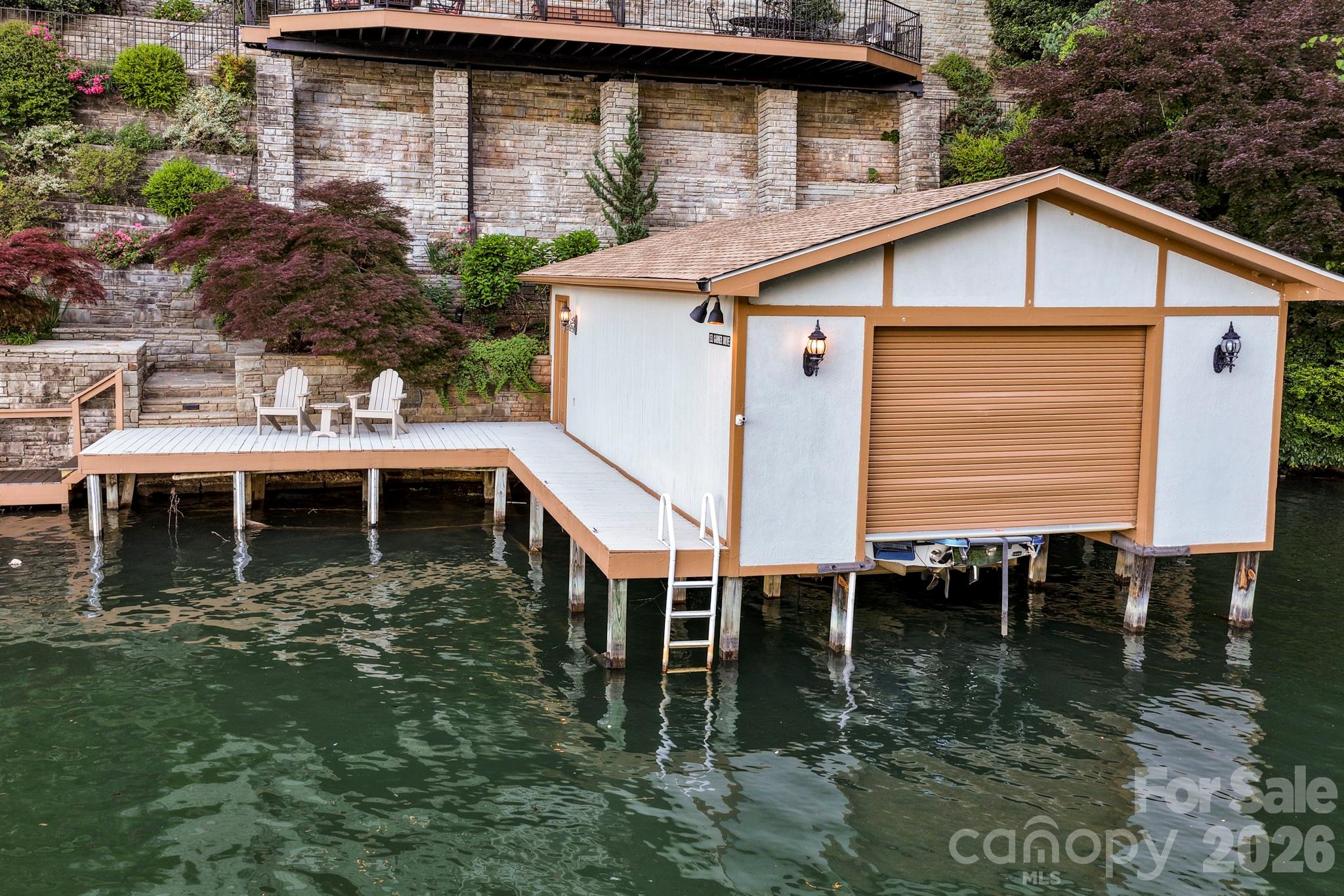 151 Garner Road Lake Lure, NC 28746 - Photo 43 of 48 a view of a house with pool and chairs