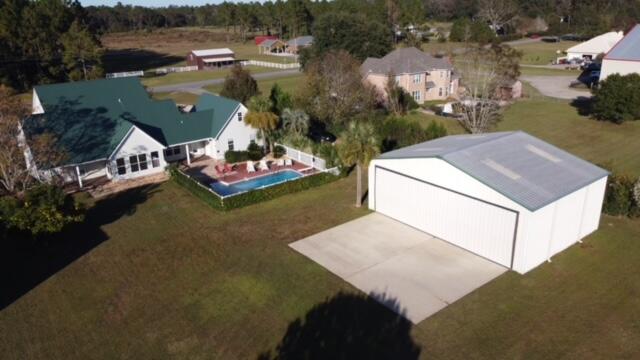 1510 Vinson Ray Road Baker, FL 32531 - Photo 46 of 60 an aerial view of a house with a garden and lake view