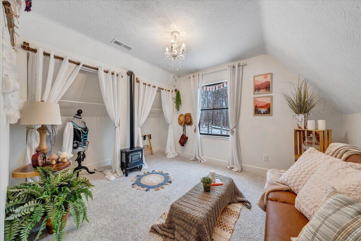 3851 Joppa Mill Road Moneta, VA 24121 - Photo 81 of 104 a bed room with furniture and a chandelier
