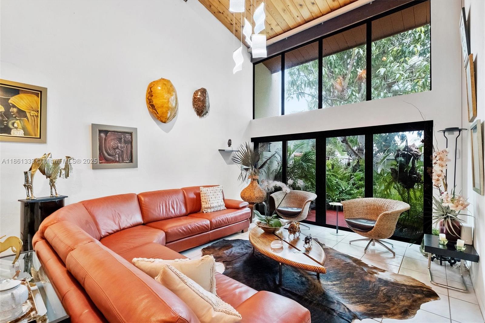 10409 Southwest 80th Street Miami, FL 33173 - Photo 14 of 35 a living room with furniture and a large window