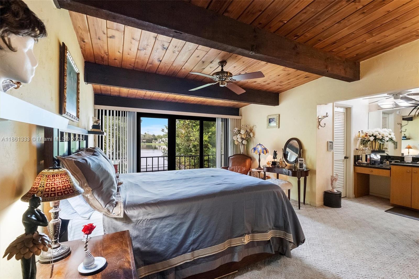 10409 Southwest 80th Street Miami, FL 33173 - Photo 23 of 35 a bed sitting in a room next to a window