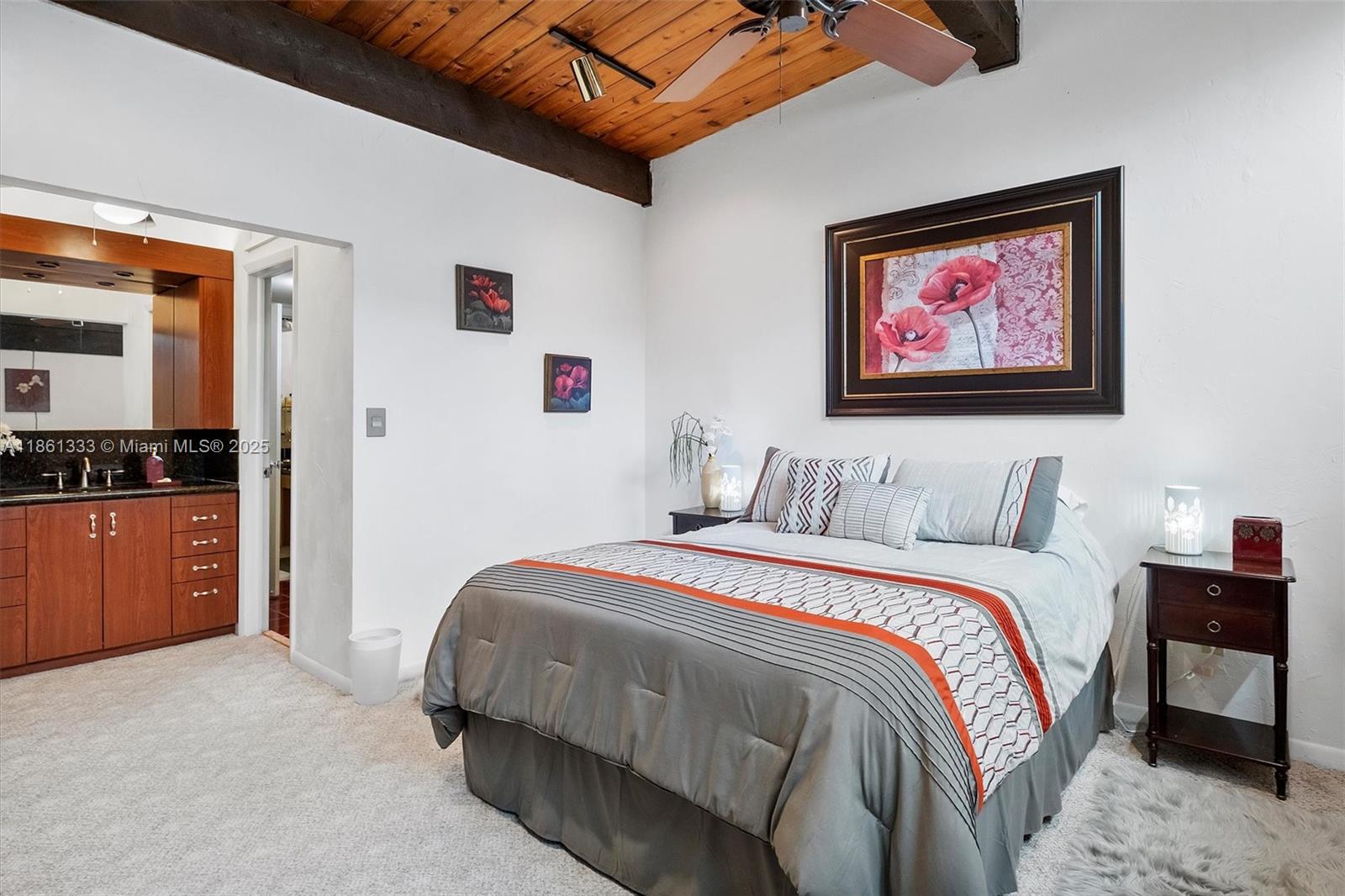10409 Southwest 80th Street Miami, FL 33173 - Photo 27 of 35 a bedroom with a bed and a view of kitchen
