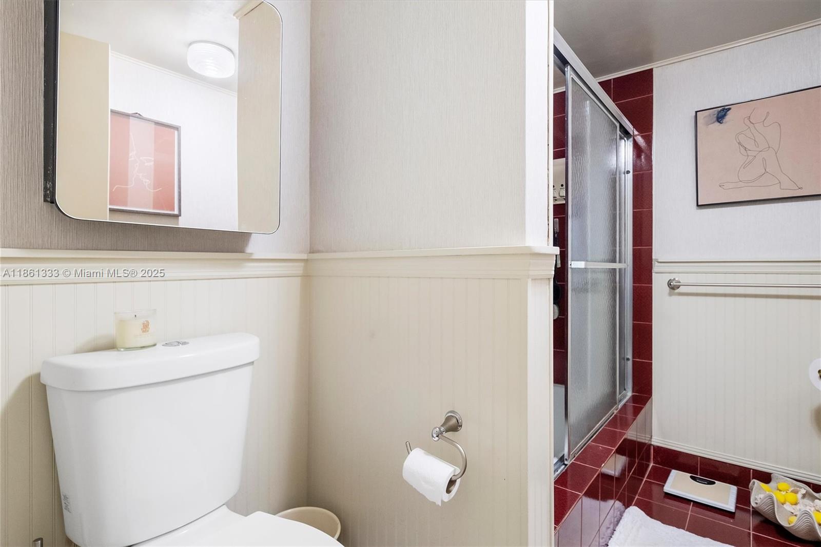 10409 Southwest 80th Street Miami, FL 33173 - Photo 29 of 35 a bathroom with a sink mirror vanity and toilet