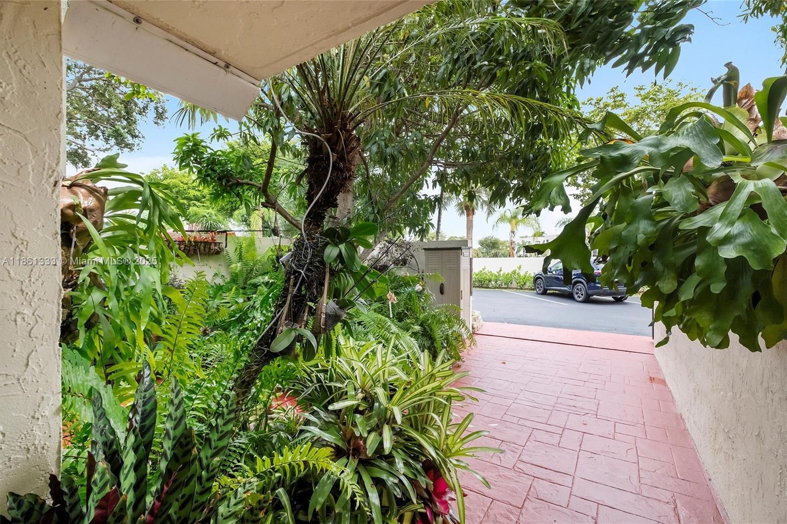 10409 Southwest 80th Street Miami, FL 33173 - Photo 4 of 35 a view of path along with trees