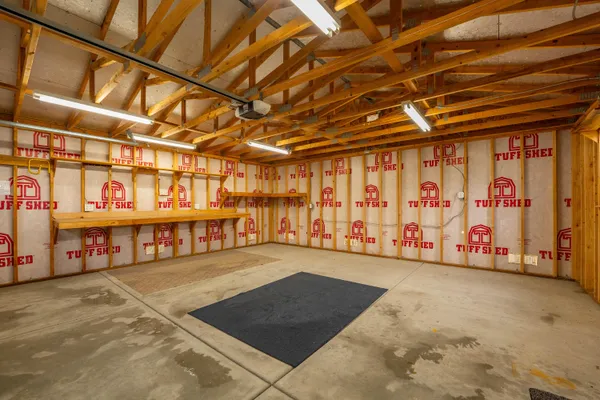 a view of a room with wooden floor and outdoor space
