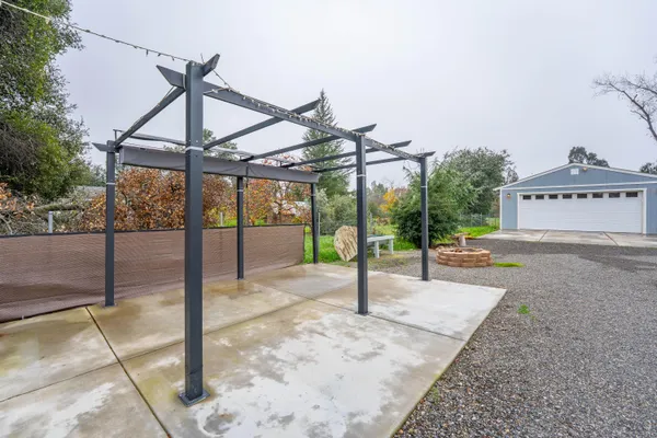 a swimming pool with the trees in the background