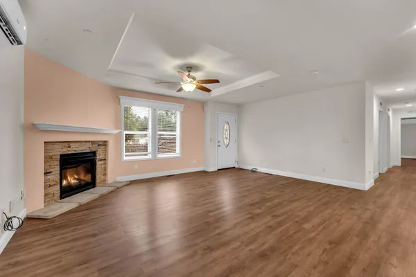 a view of kitchen with kitchen island and stainless steel appliances
