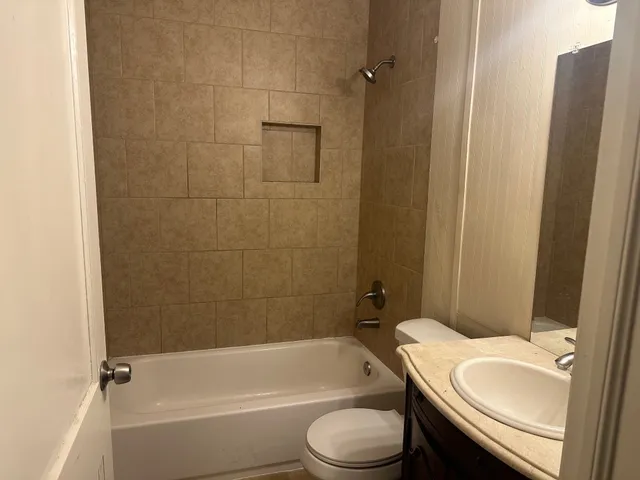 a bathroom with a sink a toilet and a bathtub