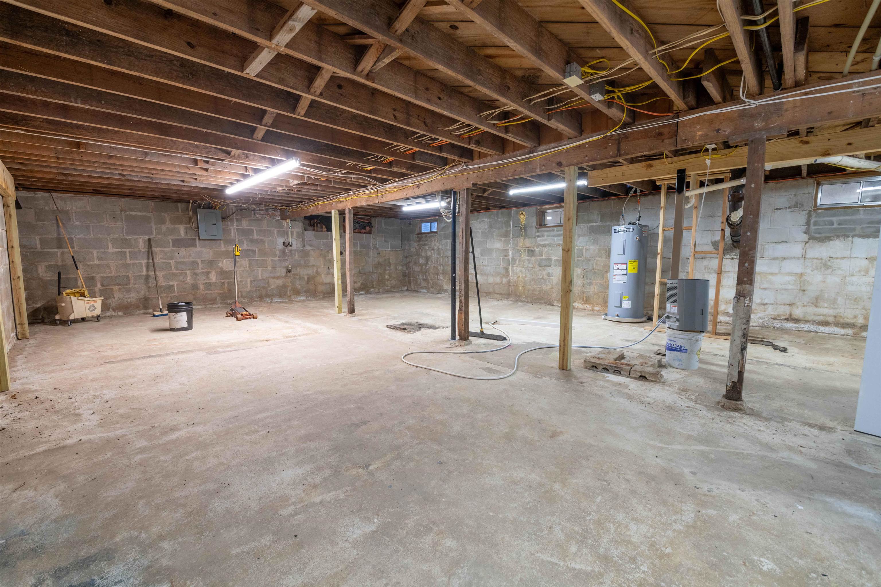 1239 Whitten Road Memphis, TN 38134 - Photo 21 of 24 Unfinished below grade area with water heater and electric panel