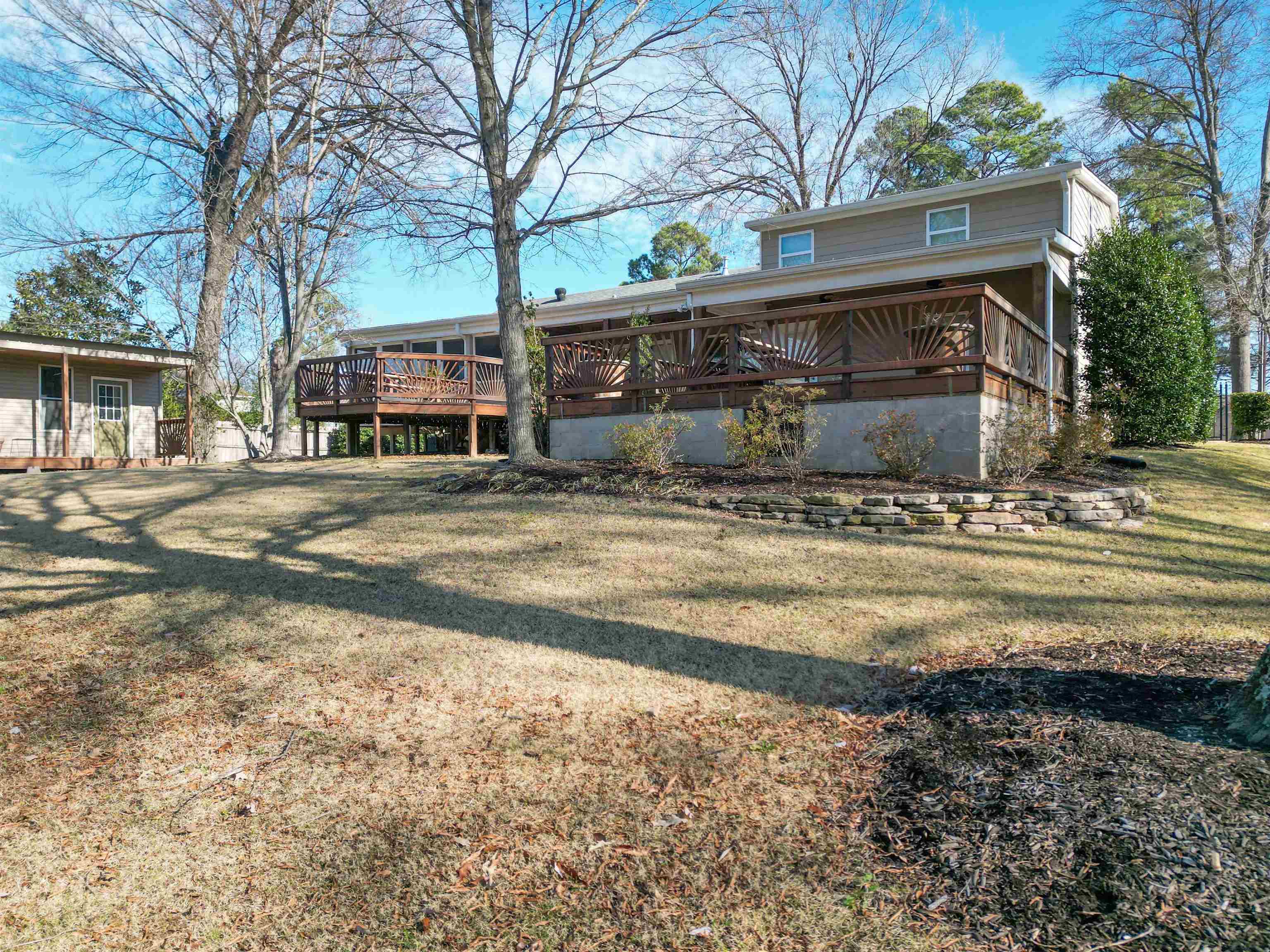 1239 Whitten Road Memphis, TN 38134 - Photo 4 of 24 Back of property featuring a lawn and a wooden deck