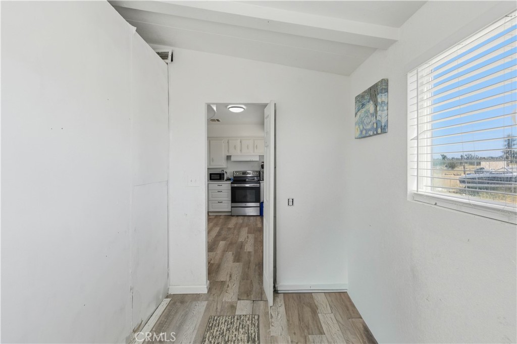 5885 Dos Palmas Road Phelan, CA 92371 - Photo 16 of 40 a view of wooden floor in a room