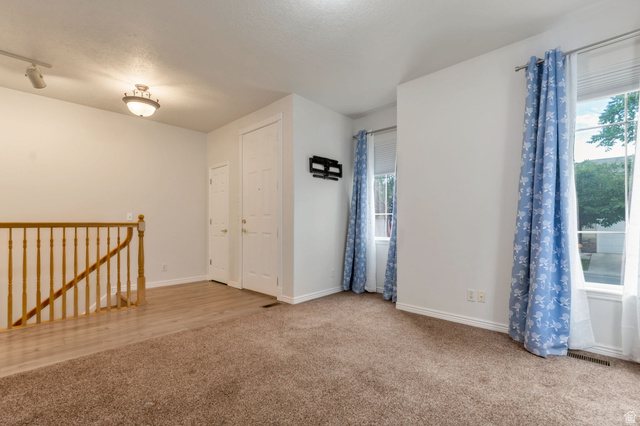 1092 Tithing Ridge Drive Riverton, UT 84065 - Photo 15 of 25 Front door into living room, staircase to basement