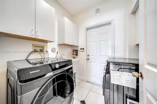 a view of a kitchen with washer and dryer