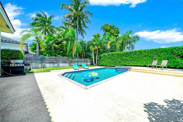 a view of swimming pool with a yard