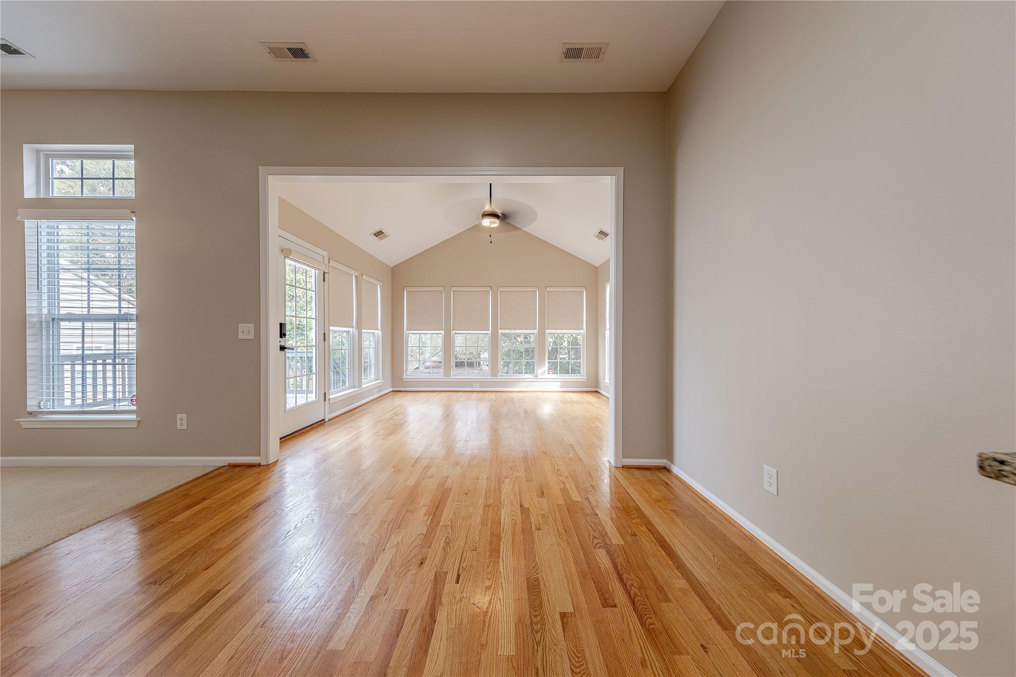 7216 Meyer Road Fort Mill, SC 29715 - Photo 18 of 47 a view of empty room with wooden floor and fan