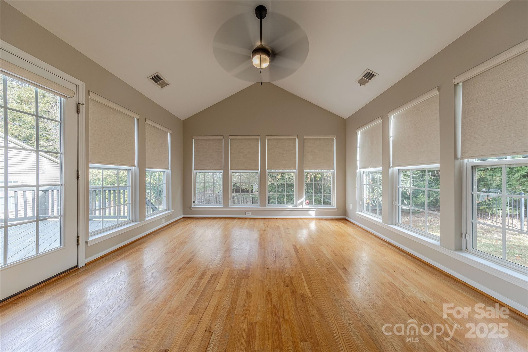 7216 Meyer Road Fort Mill, SC 29715 - Photo 21 of 47 a view of an empty room with wooden floor and a window