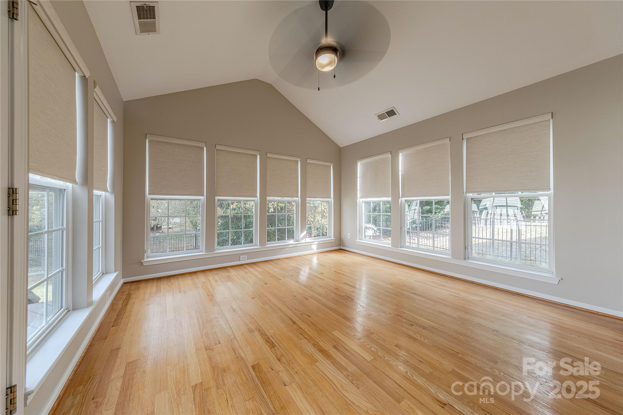 7216 Meyer Road Fort Mill, SC 29715 - Photo 22 of 47 a view of an empty room with wooden floor and a window