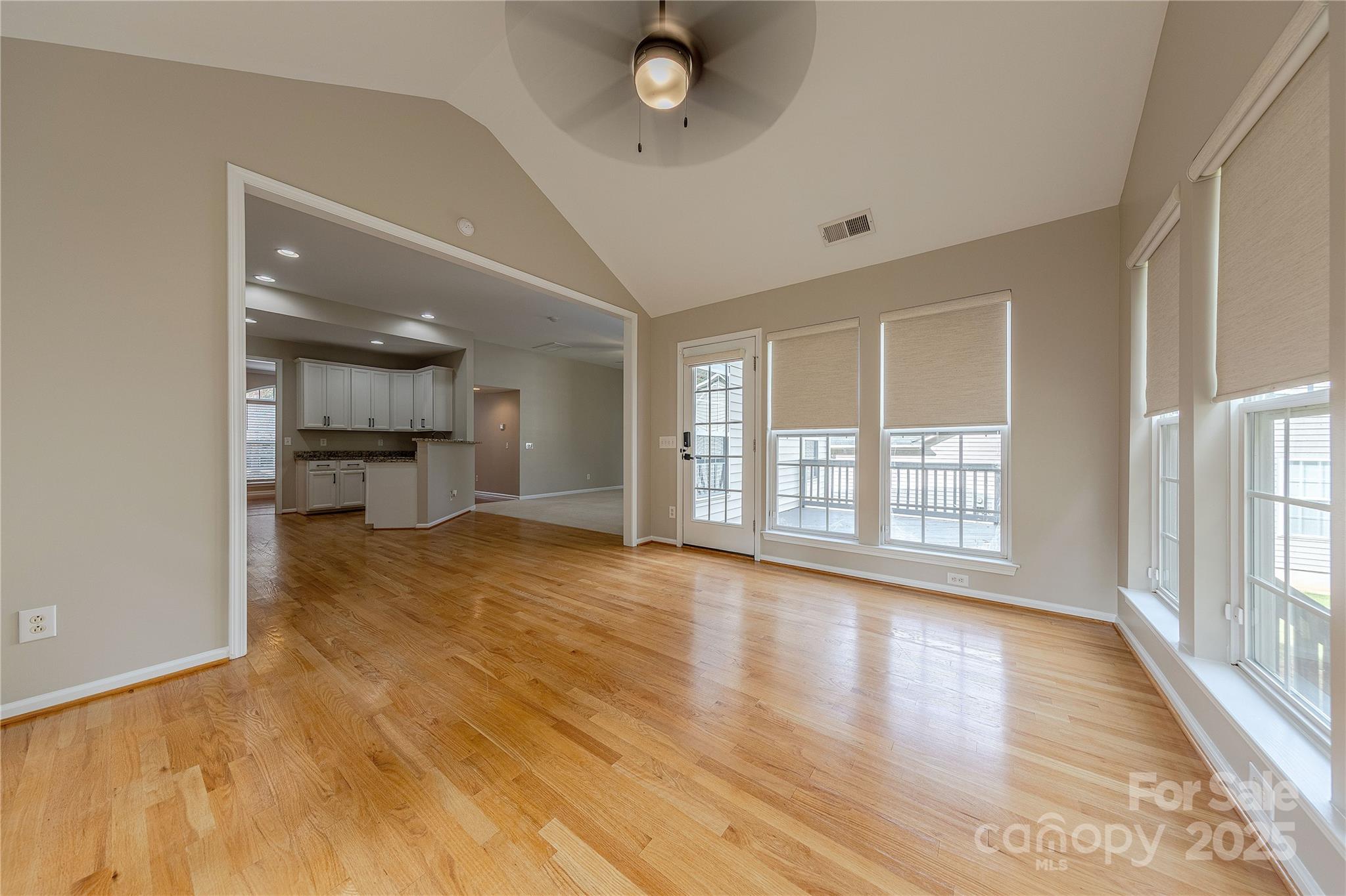 7216 Meyer Road Fort Mill, SC 29715 - Photo 24 of 47 a view of an empty room with a window and wooden floor