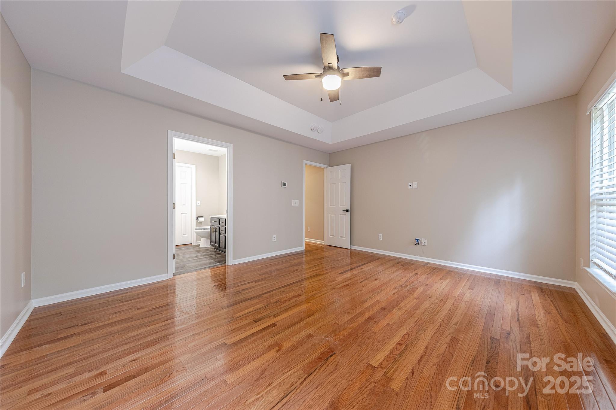 7216 Meyer Road Fort Mill, SC 29715 - Photo 27 of 47 a view of an empty room with wooden floor