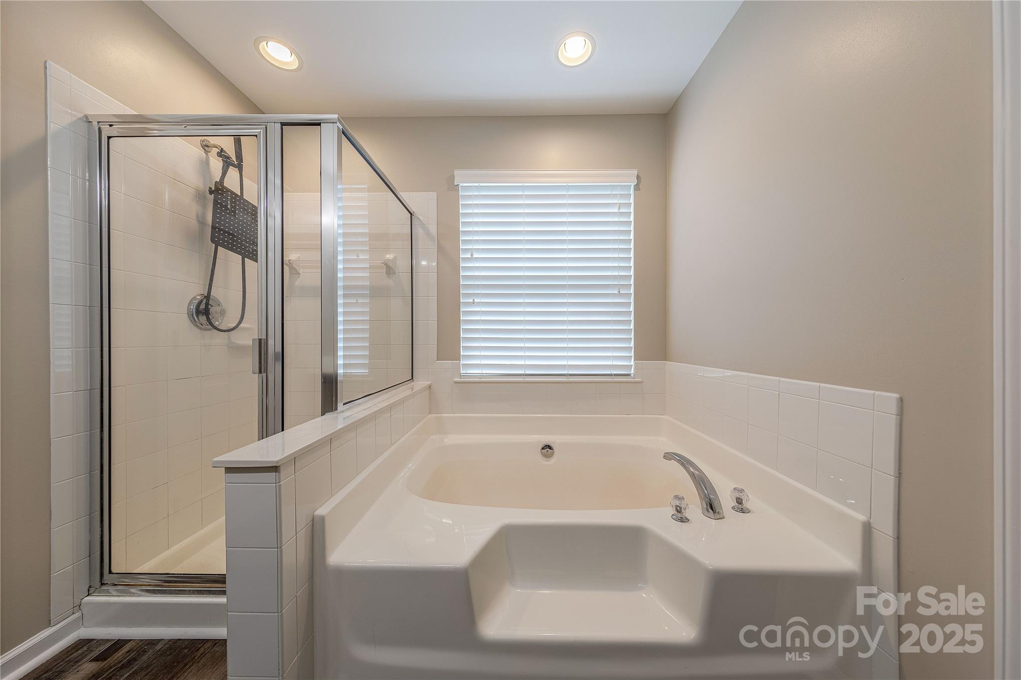 7216 Meyer Road Fort Mill, SC 29715 - Photo 30 of 47 a bathroom with a sink a shower and a bathtub
