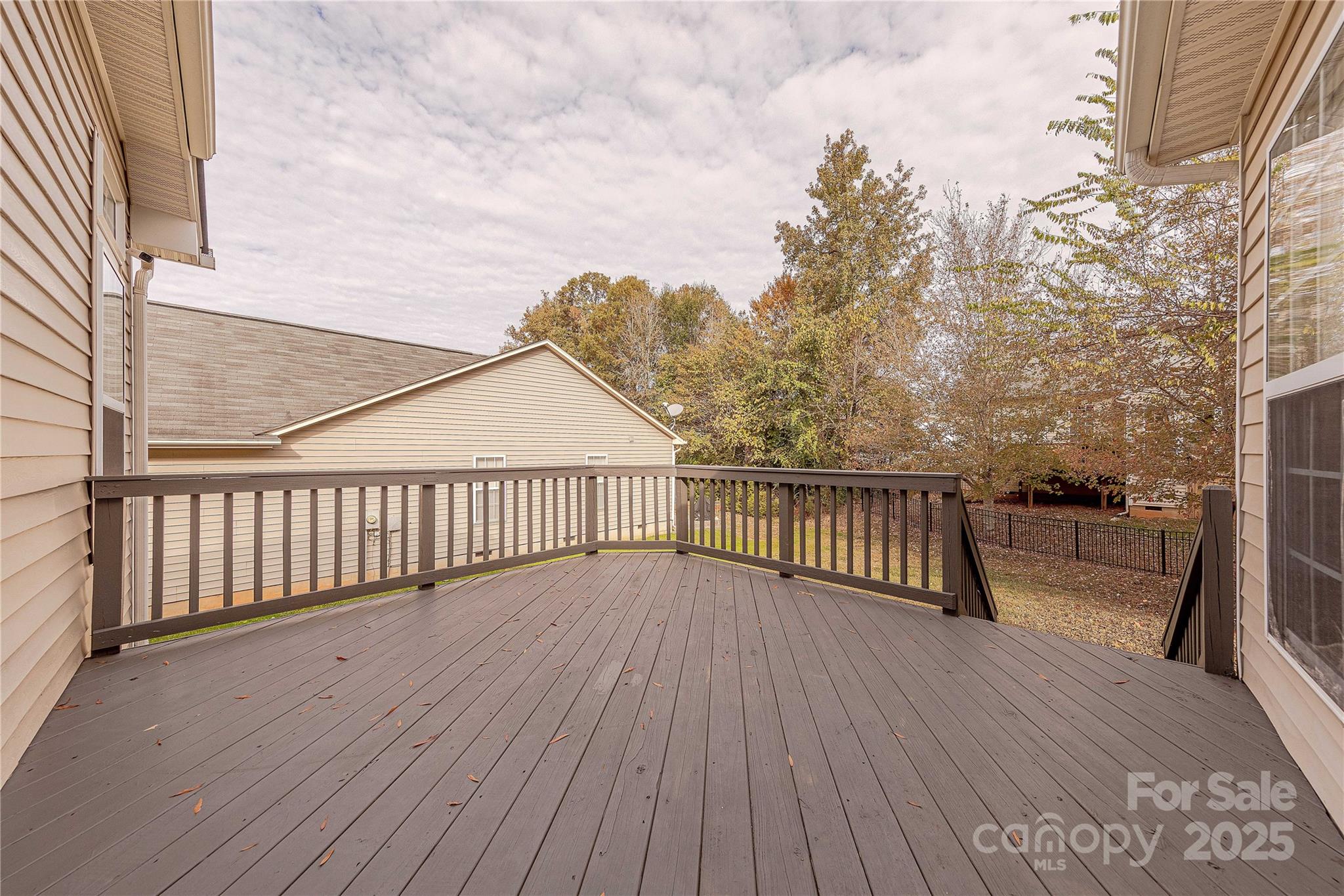 7216 Meyer Road Fort Mill, SC 29715 - Photo 42 of 47 a view of a balcony with wooden floor and fence