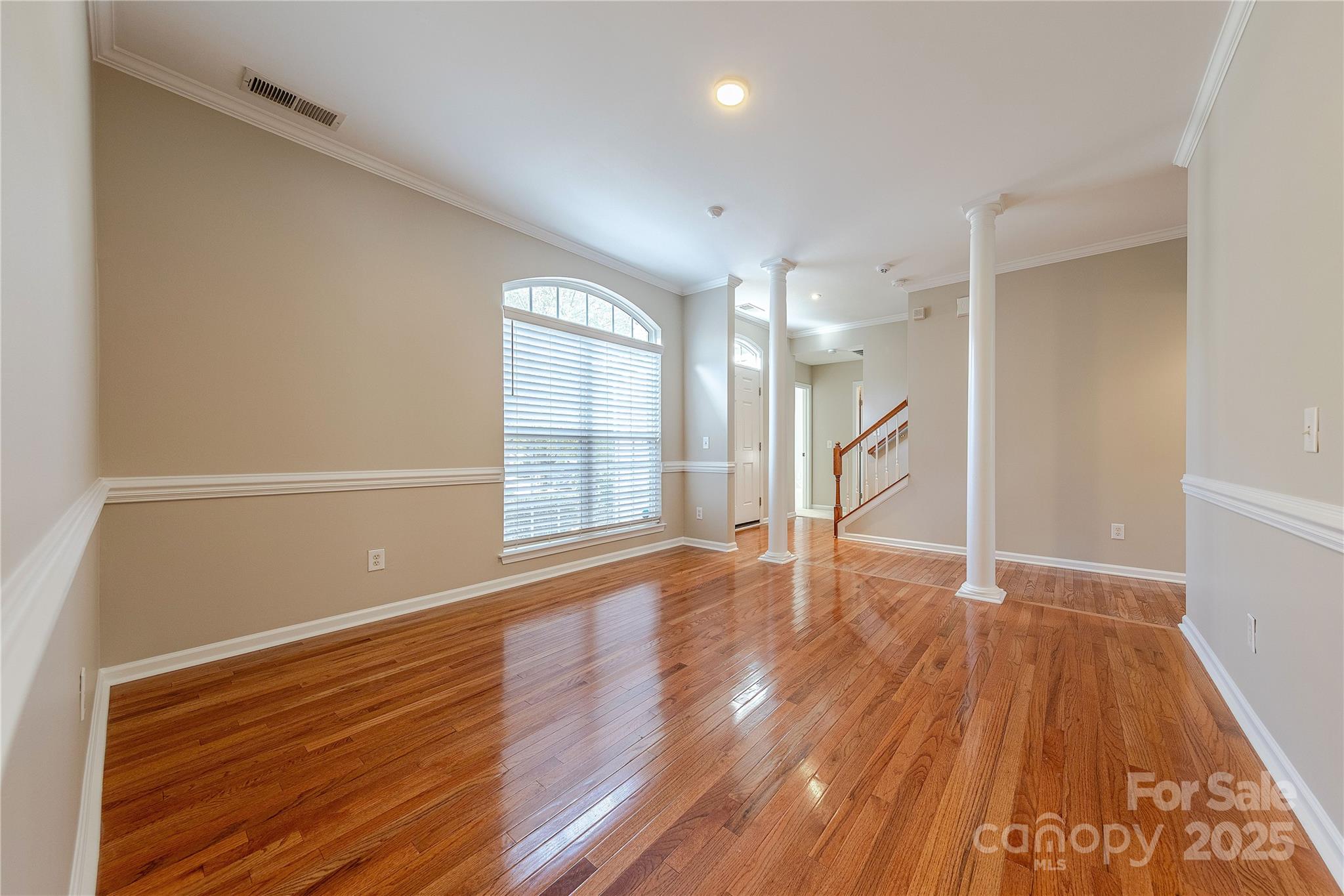 7216 Meyer Road Fort Mill, SC 29715 - Photo 6 of 47 a view of an empty room with wooden floor and a window