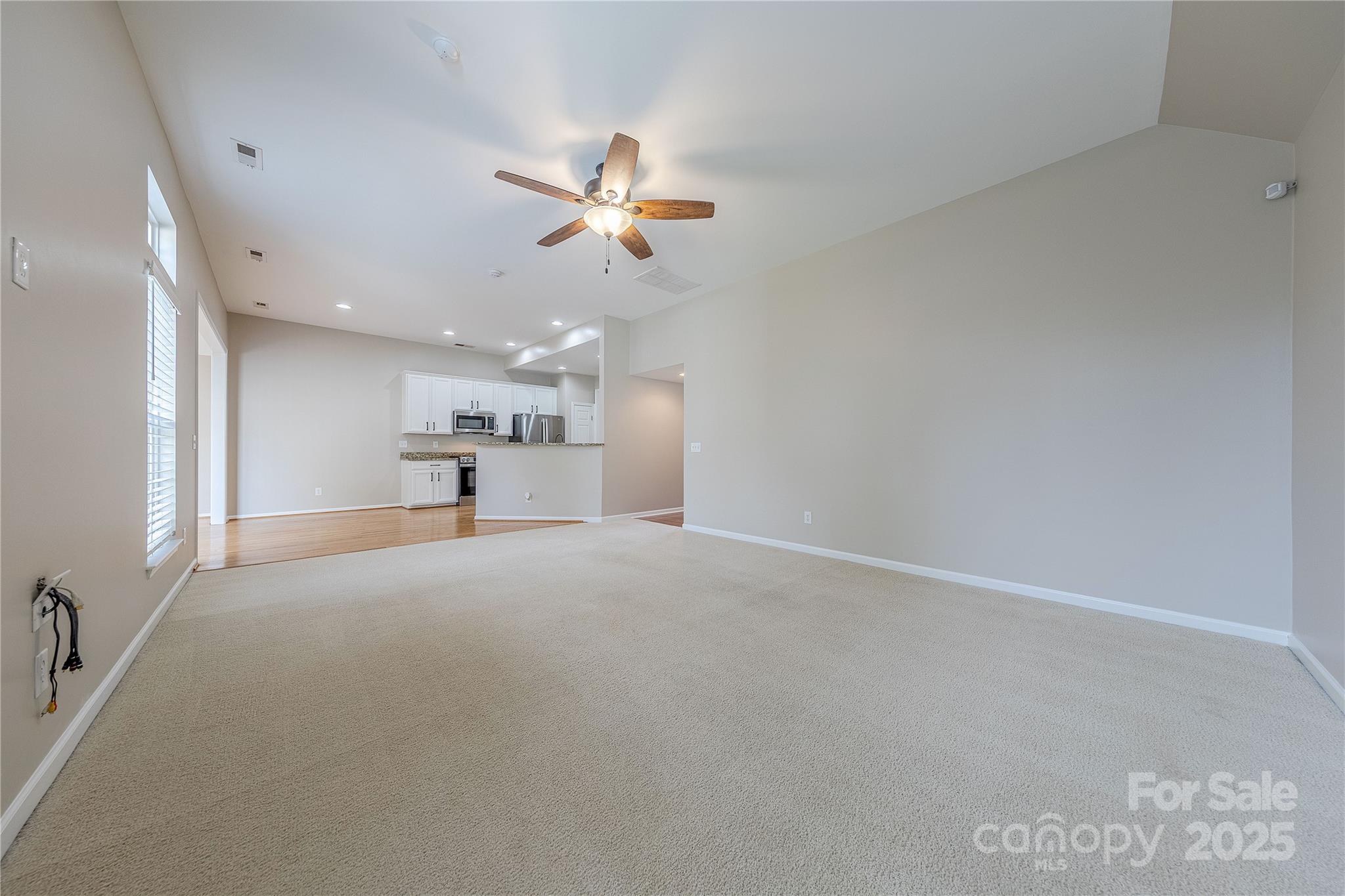 7216 Meyer Road Fort Mill, SC 29715 - Photo 9 of 47 a view of empty room with a kitchen