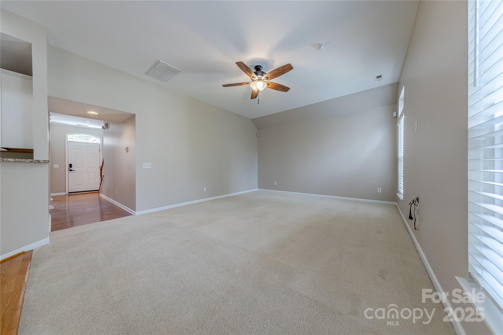 7216 Meyer Road Fort Mill, SC 29715 - Photo 10 of 47 a view of a livingroom with a ceiling fan and window