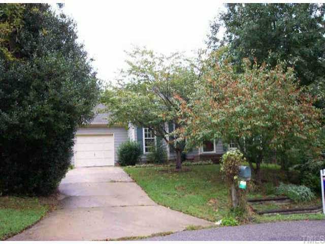 3637 Wickersham Way Raleigh, NC 27604 - Photo 1 of 1 a front view of a house with garden