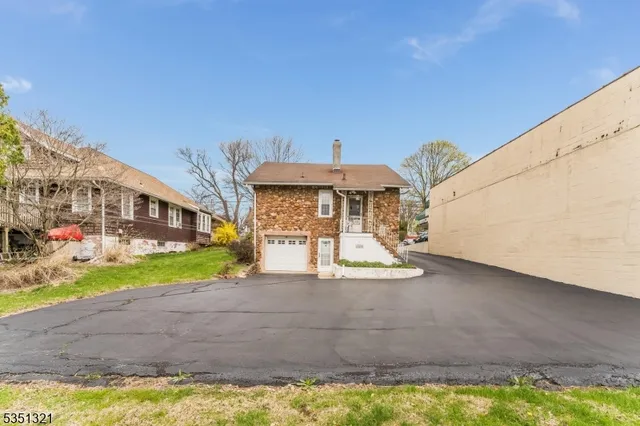 a view of a street with houses on both side of it