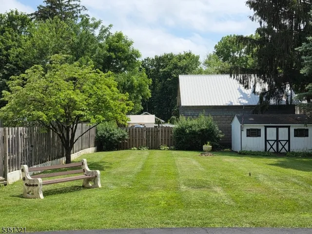 a view of a house with backyard porch and sitting area
