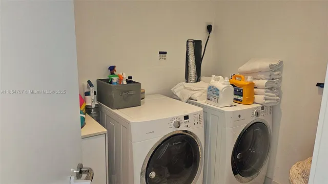 a utility room with dryer and washer