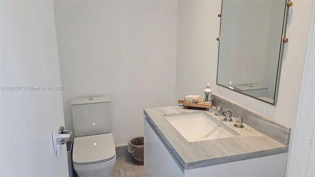 a bathroom with a sink and a toilet