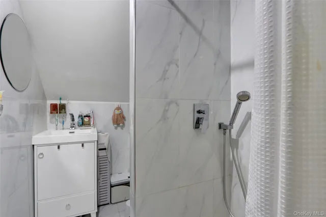 a bathroom with a sink and a shower