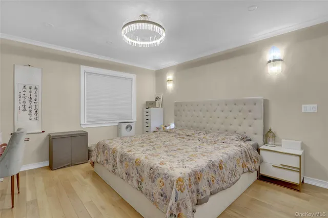 a spacious bedroom with a bed and cabinets