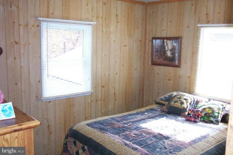 14825 Rice Road Hancock, MD 21750 - Photo 14 of 20 a bedroom with a bed and a window