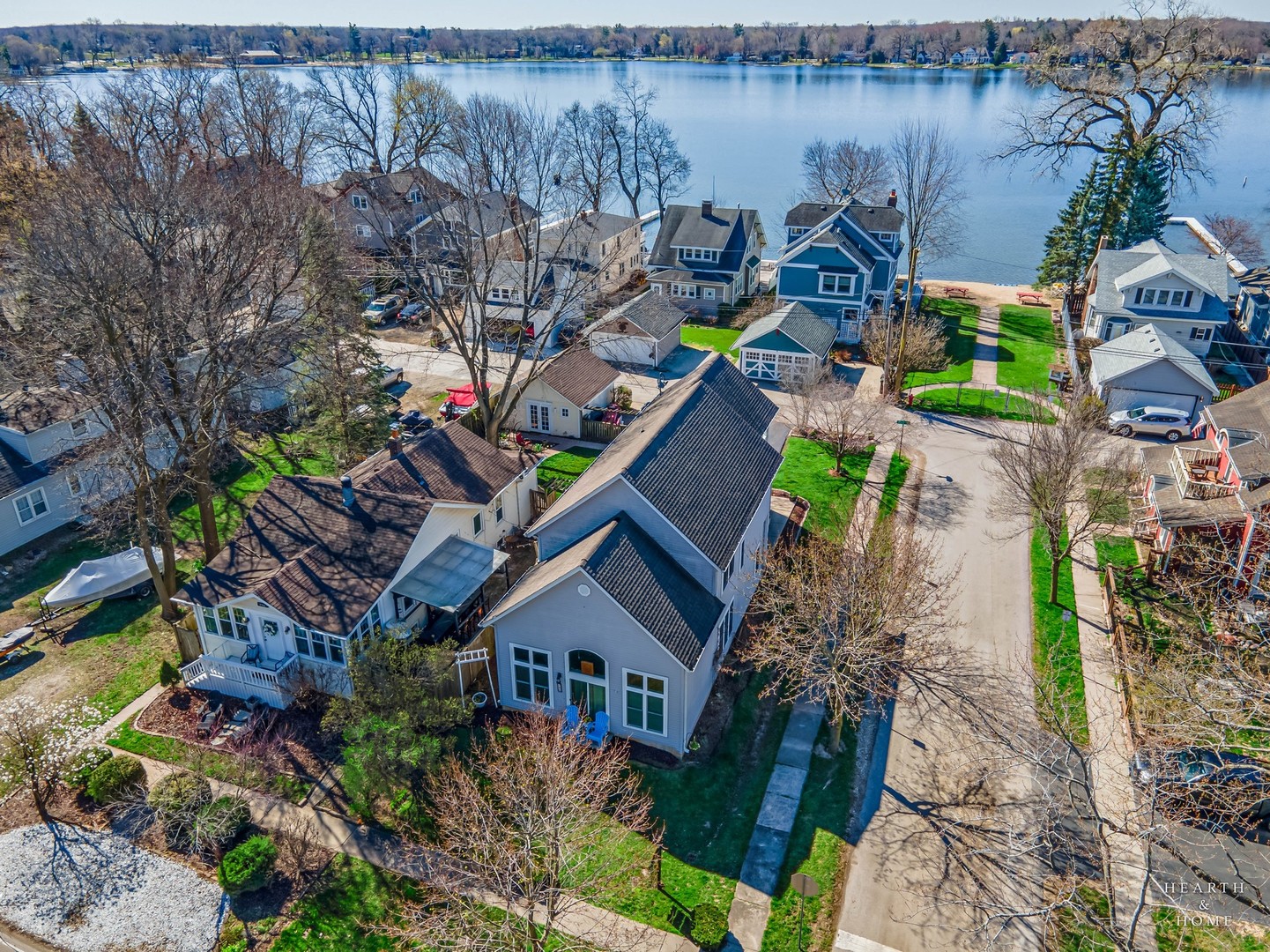 an aerial view of a house with a lake view