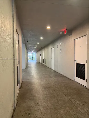 a view of a hallway with stairs
