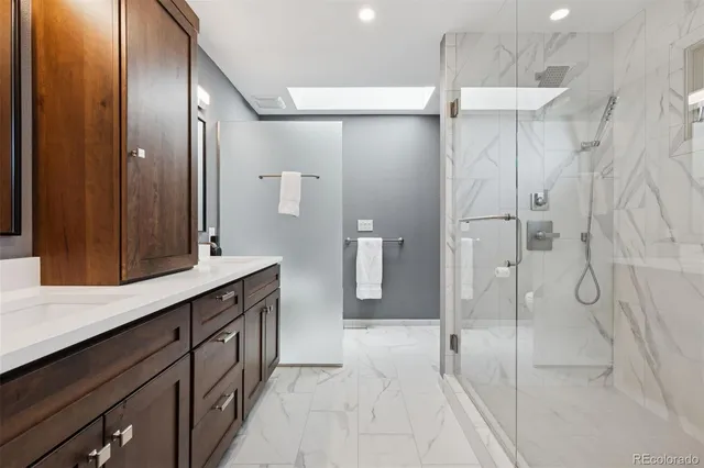 a bathroom with a shower and a sink